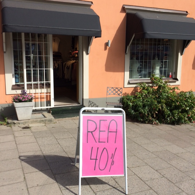 REA skylt och butik